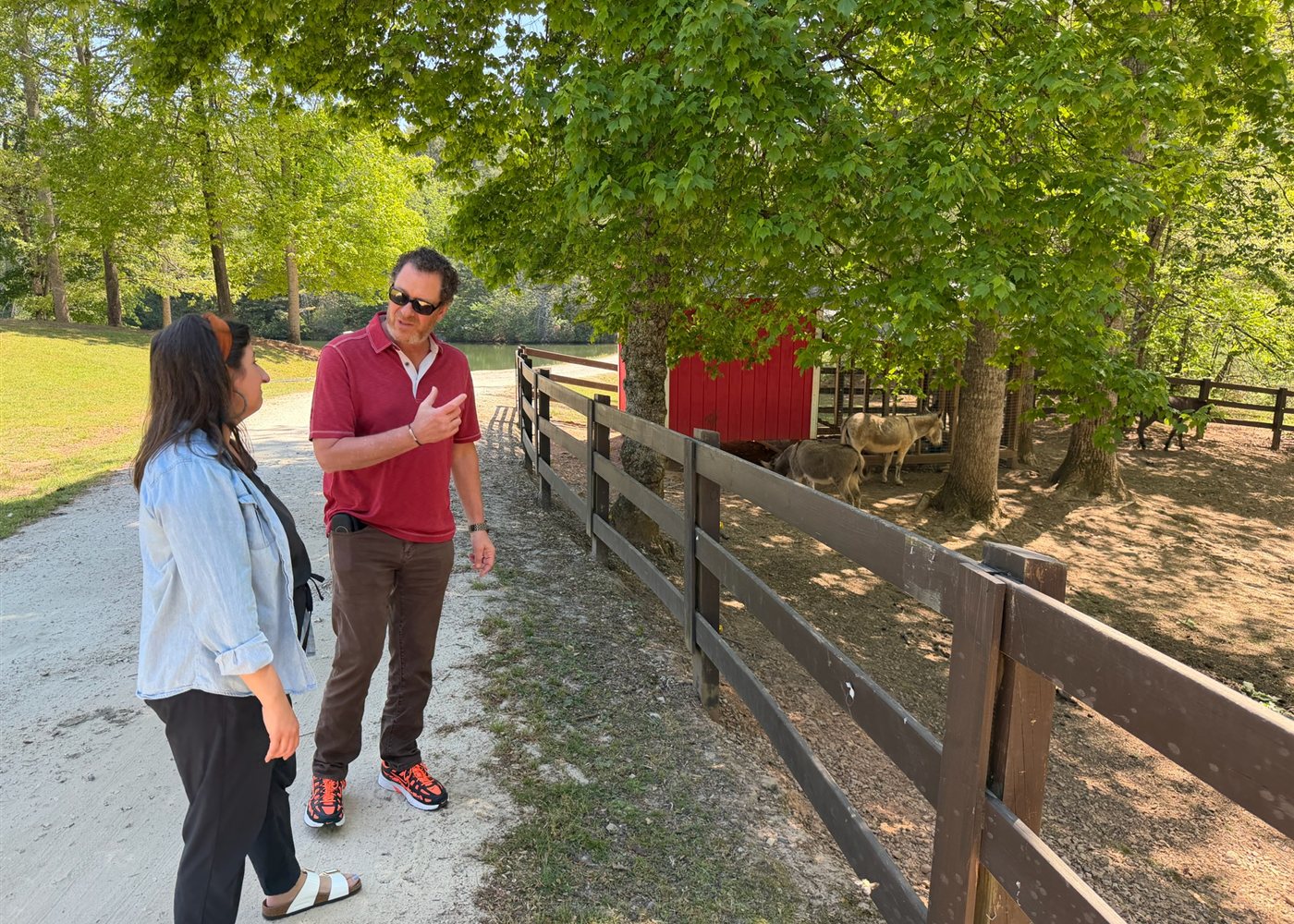 Dr. Cohen talking with a family member while touring a program